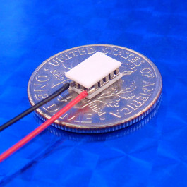 image of mini micro peltier TEC cooler module 01111-9N30-20CN shown sitting on USA Dime 10 cent coin for scale