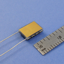 image of rectangular TEC mini micro module part # 02301-9B30-32RU6A shown next to ruler for scale