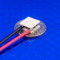 image of mini micro peltier TEC cooler module 00711-5L31-03CA shown sitting on USA Dime 10 cent coin for scale