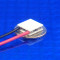 image of mini micro peltier TEC cooler module 00711-5L31-12CB shown sitting on USA Dime 10 cent coin for scale