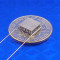 image of mini TEC part number 03201-9U30-08RA sitting on USA Dime 10 cent coin for scale