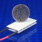 picture of rectangular peltier chip part number 03511-5P31-12CFL shown with USA Dime 10 cent coin for scale