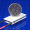 image of rectangular TEC module part number 03511-5L31-06CFL shown with USA Dime 10 cent coin for scale